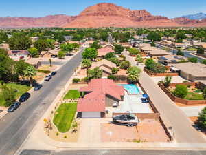 Aerial view of residential area featuring a mountain backdrop