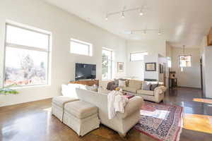Living room with concrete floors and vaulted ceiling