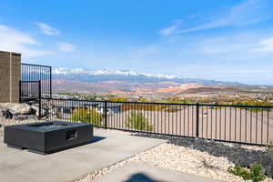 View of patio / terrace featuring a mountain view and an outdoor fire pit