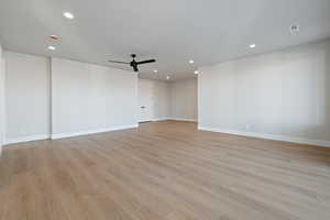Spare room with light wood-type flooring, recessed lighting, and a ceiling fan