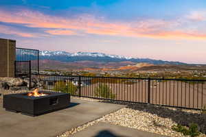 View of patio / terrace with a mountain view and an outdoor fire pit