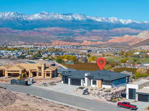 View of mountain background featuring nearby suburban area