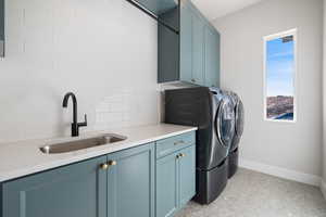 Laundry room with washer and dryer and cabinet space