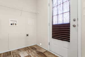 Washroom with hardwood / wood-style floors, electric dryer hookup, and washer hookup