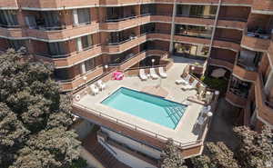 Community pool with a patio area