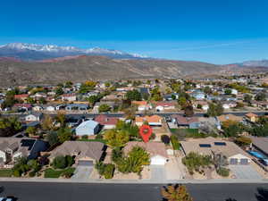 Aerial view of residential area featuring mountains