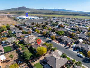 Aerial view of residential area featuring mountains