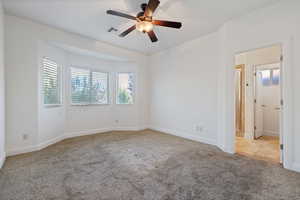 Unfurnished room with light carpet and ceiling fan