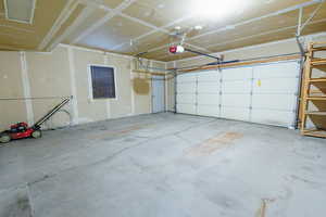 Garage featuring a garage door opener