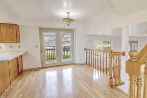 Unfurnished dining area featuring plenty of natural light and light wood finished floors