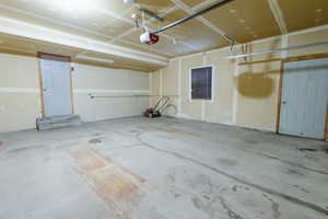 Garage featuring a garage door opener