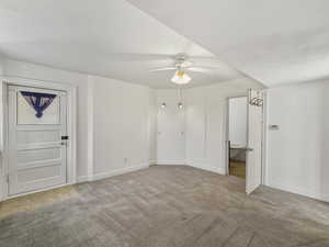 Unfurnished bedroom with light carpet and a ceiling fan
