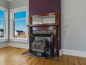 Detailed view of a wood stove and wood finished floors