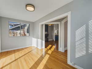 Spare room featuring light wood-style floors and ceiling fan