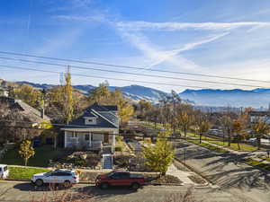 View of front of home featuring a mountain view and stairway