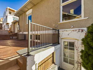 View of property exterior featuring stucco siding and a patio area