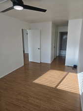 Unfurnished bedroom with wood finished floors and ceiling fan