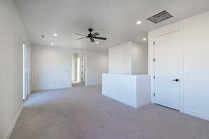Unfurnished room featuring carpet flooring, recessed lighting, and a ceiling fan