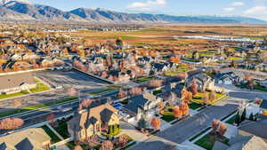 Aerial perspective of suburban area featuring a mountainous background