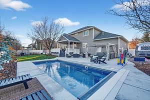 Rear view of property with a patio area, a fenced backyard, a gazebo, and a pergola