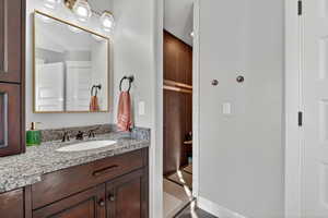 Bathroom featuring vanity and a tile shower