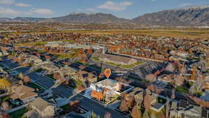 Aerial perspective of suburban area with a mountain backdrop