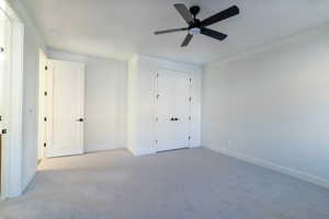 Unfurnished bedroom with carpet floors, ceiling fan, and a closet