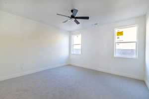 Unfurnished room with carpet and ceiling fan