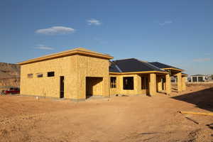 Back of house with a patio area