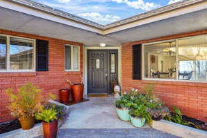 Entrance to property with brick siding