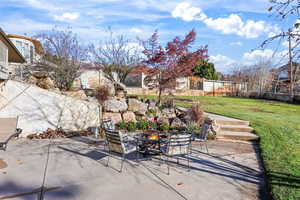 View of patio featuring an outdoor fire pit