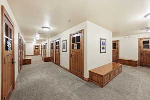 Hall featuring light carpet