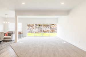 Living room featuring baseboards and recessed lighting