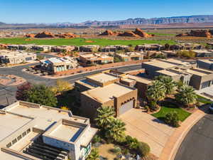 Aerial perspective of suburban area featuring a mountain backdrop