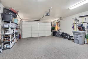 Garage featuring a garage door opener