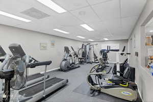 Workout area featuring a drop ceiling