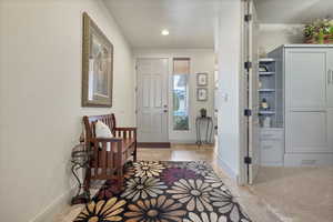 Entryway featuring stone tile floors and recessed lighting