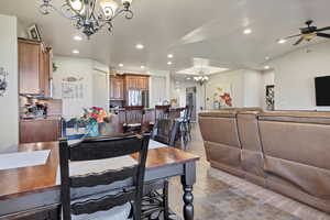 Dining area featuring a chandelier, recessed lighting, and ceiling fan