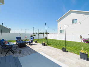 Fenced backyard featuring a patio