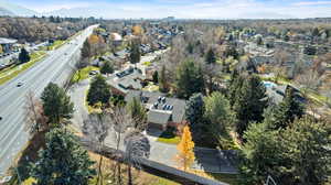 Aerial overview of property's location with a mountainous background and nearby suburban area
