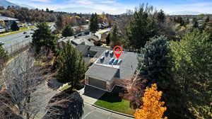 Aerial view of property's location with a mountainous background