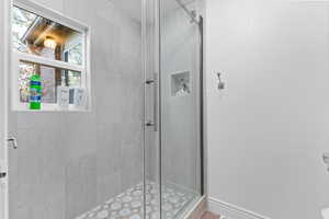 Full bathroom featuring a stall shower