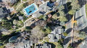 Aerial view of property's location with a pool area