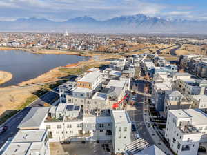 Aerial perspective of suburban area with a water and mountain view