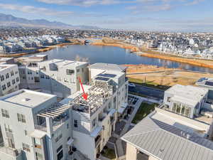 Aerial perspective of suburban area featuring a water and mountain view