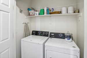 Laundry room featuring washing machine and dryer