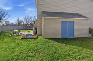 View of outbuilding featuring a fenced backyard