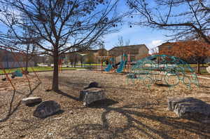 Community playground featuring a residential view