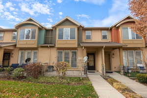 View of front of property featuring stucco siding and a porch