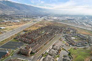 Aerial view of property's location featuring nearby suburban area and a mountain backdrop